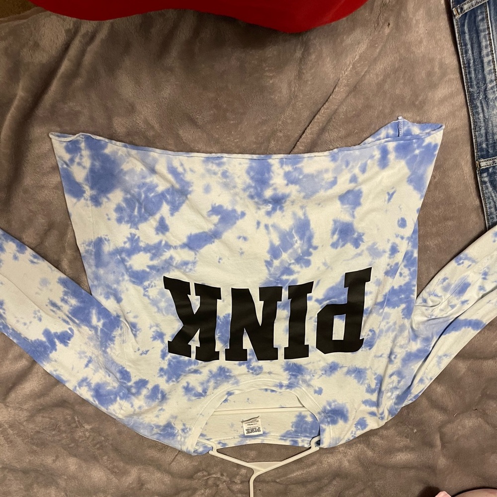 long sleeved top from PINK, blue and white tie dye with black lettering